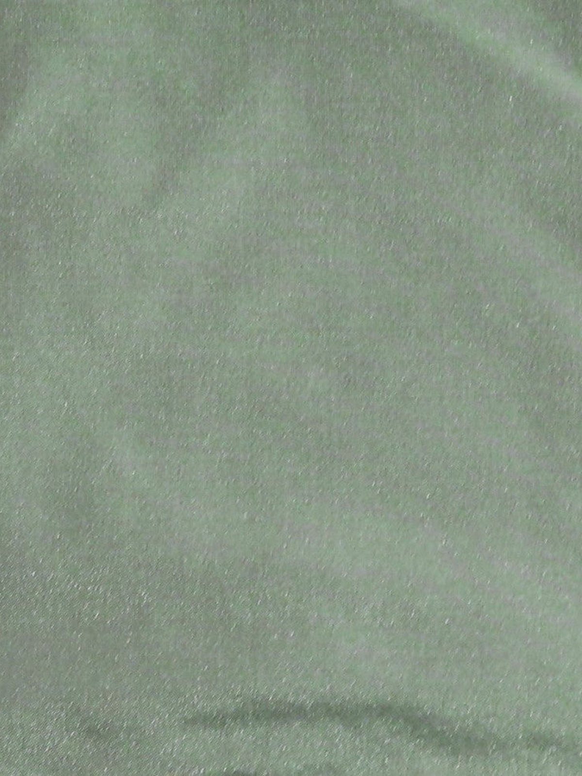 Pista green silk upholstery fabric in a plain, even colour