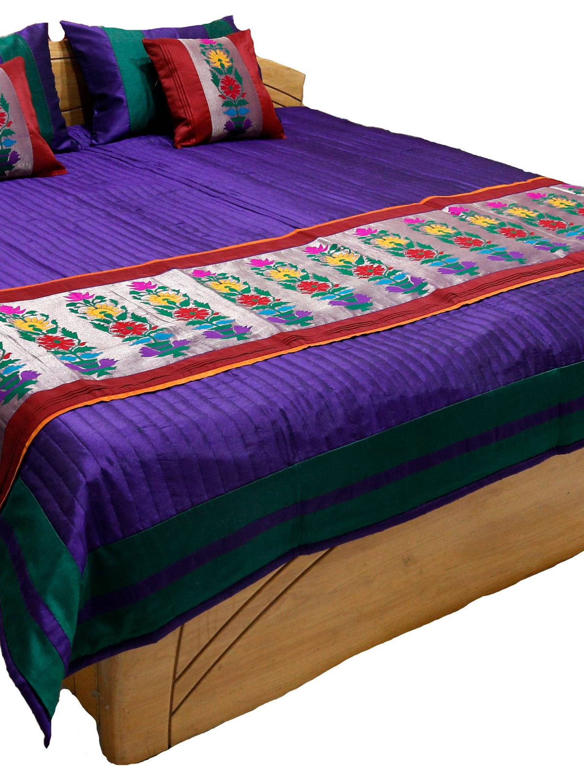 Purple satin-stripe reversible bedcover with a multicolour floral-embroidered runner and matching cushions