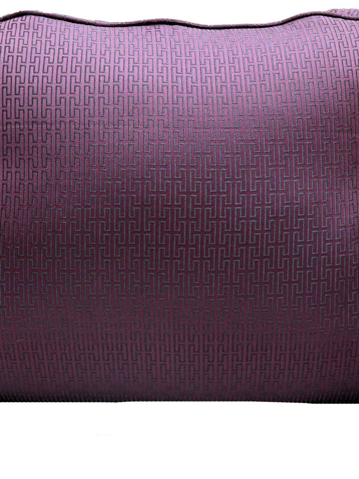 Close-up of the plum back cushion cover in a black Greek key jacquard weave