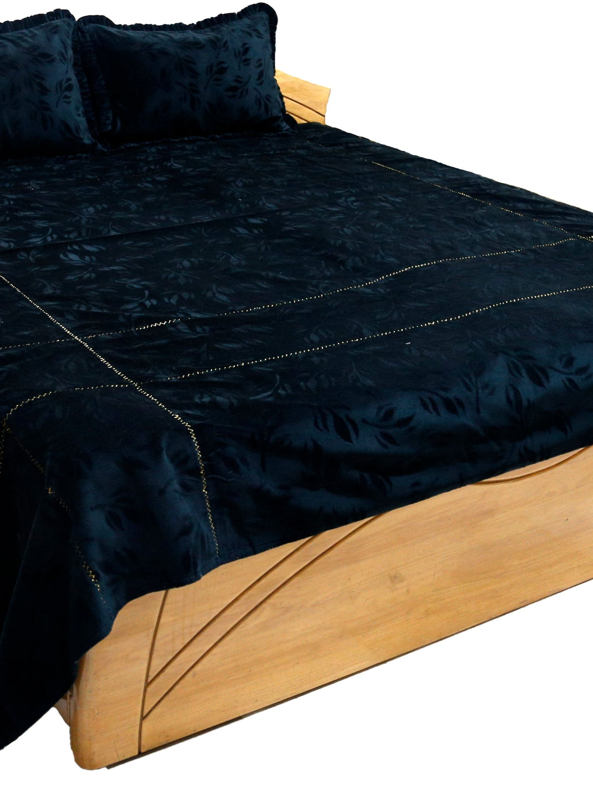 Black bedcover with an embossed woven leaf pattern, styled with 2 matching pillow covers
