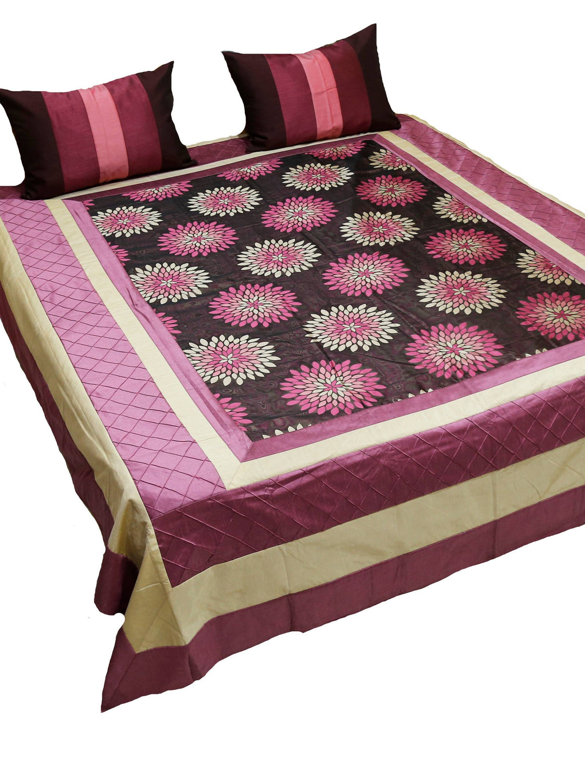 Wine and black bedcover with pink lotus medallions, cream border and two cushions