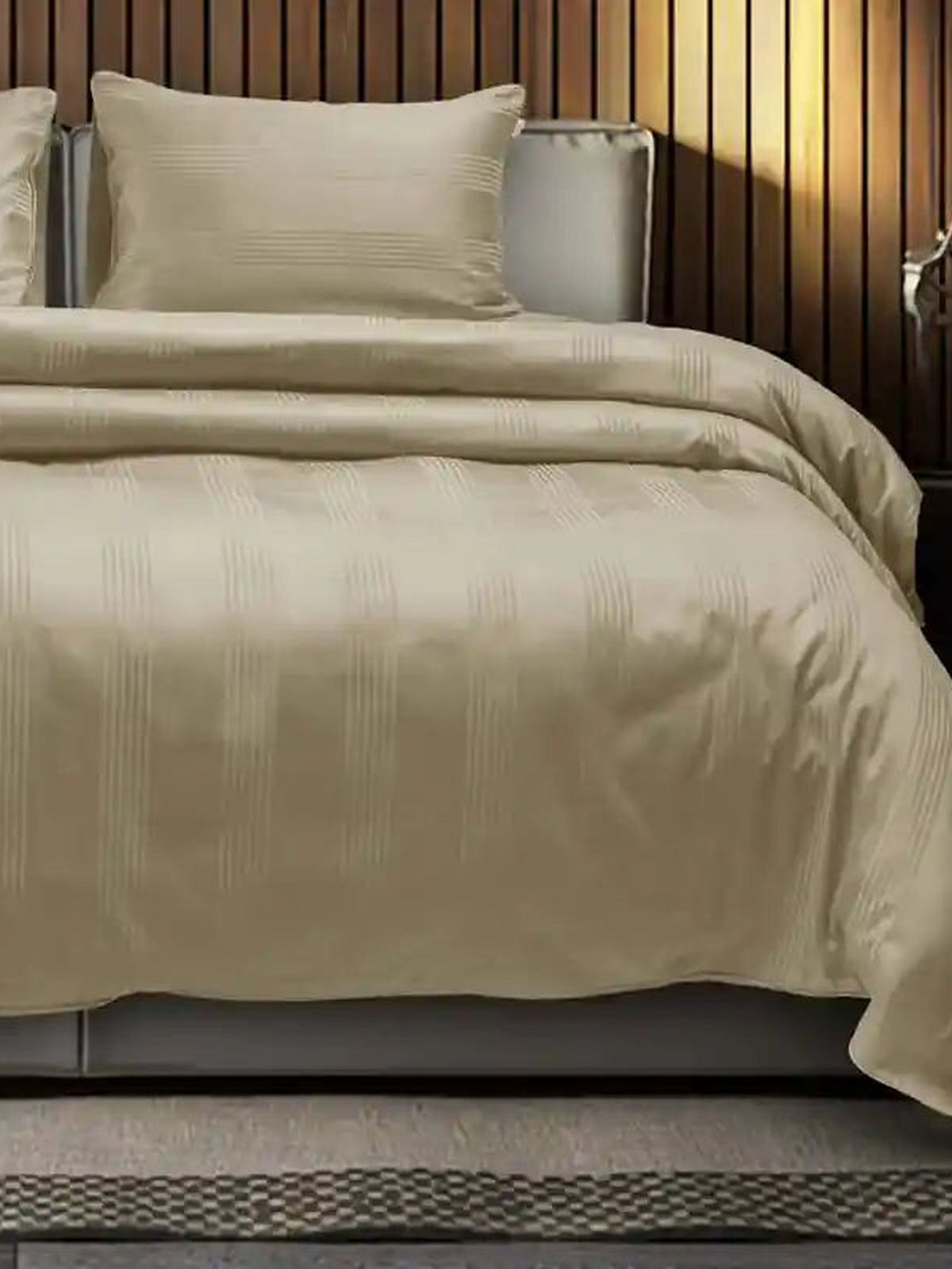 Sand beige satin stripe cotton bedsheet on a made bed with matching pillow