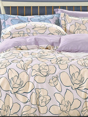 White bedding with outline magnolia blooms and lilac pillows, Four Seasons 350TC FSXL 40255