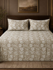 Greige floral print cotton bedcover set with two matching pillow covers on a bed