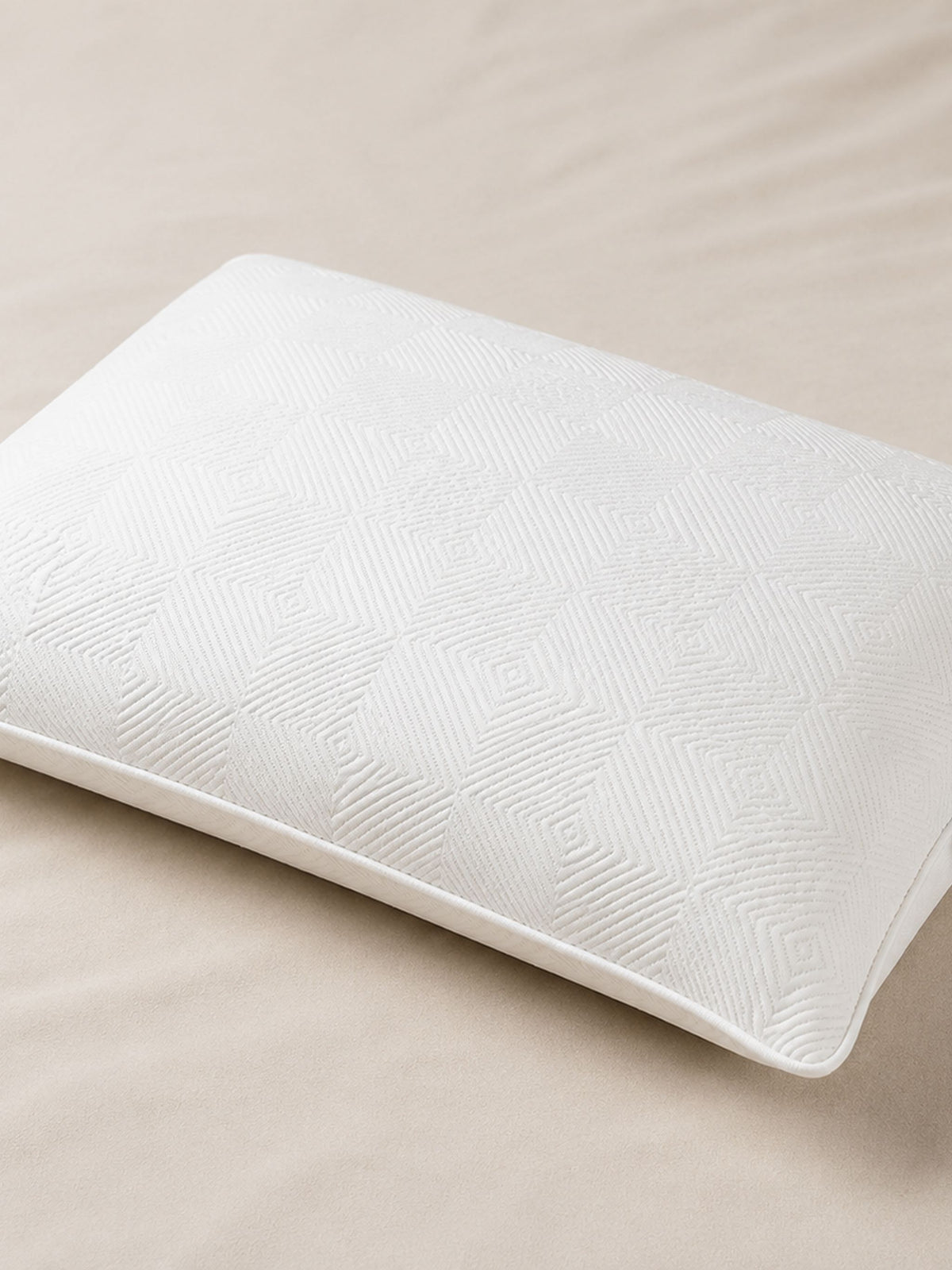 White latex pillow on a bed, mmFoam Snuggle Pillow