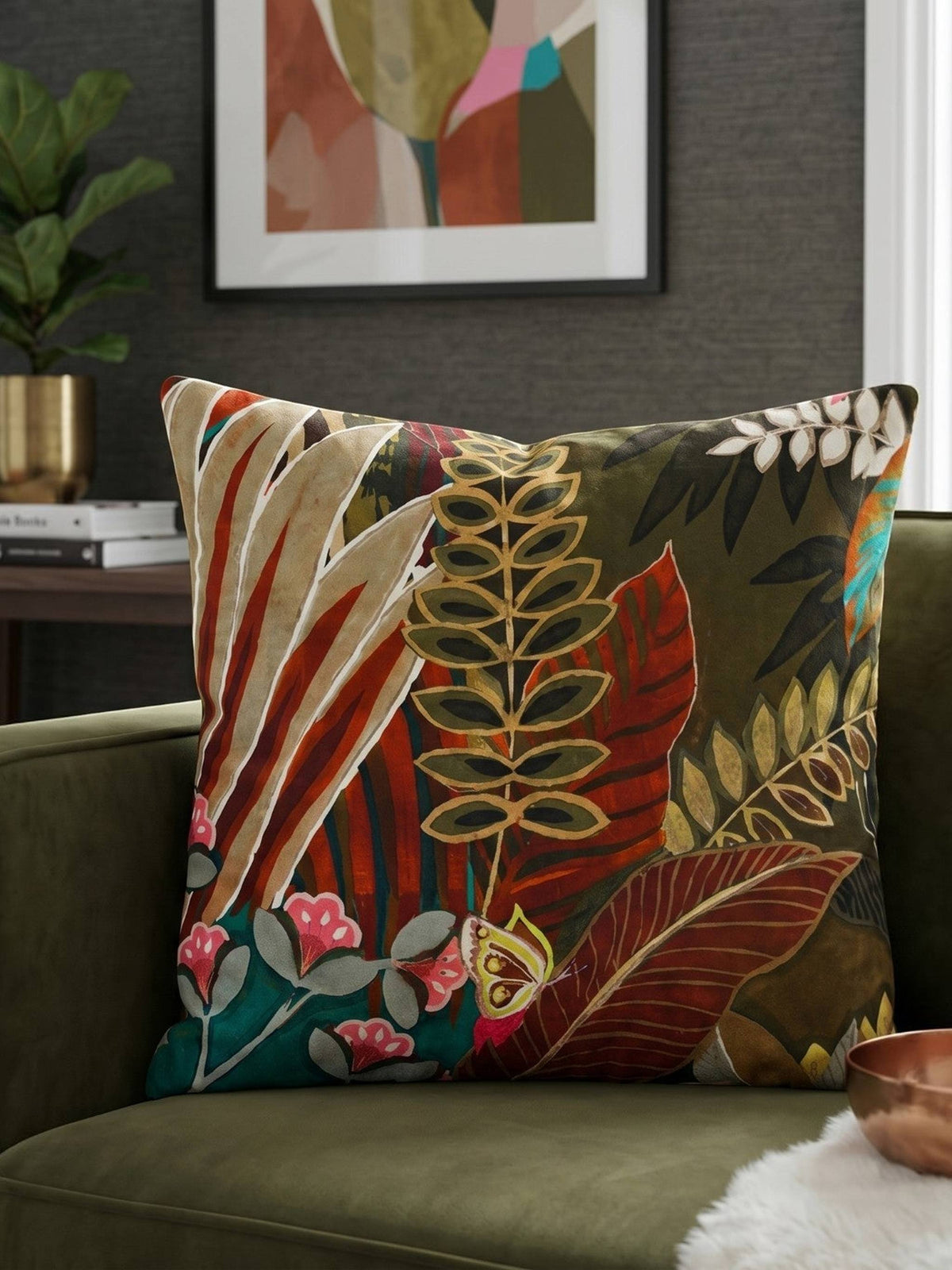 Tropical botanical printed cotton cushion cover featuring colorful leaves and floral motifs on a sofa