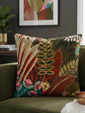 Tropical botanical printed cotton cushion cover featuring colorful leaves and floral motifs on a sofa