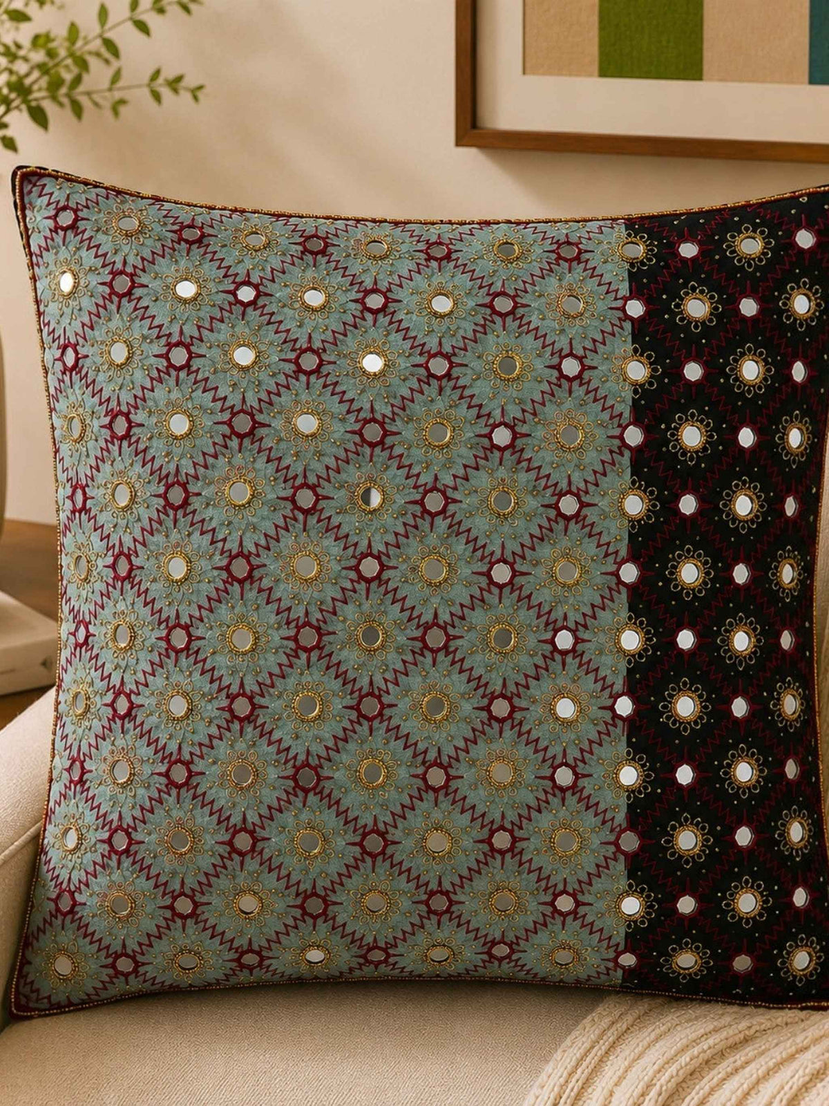 Sage green polysilk cushion cover featuring embroidered motifs with decorative bead work accents