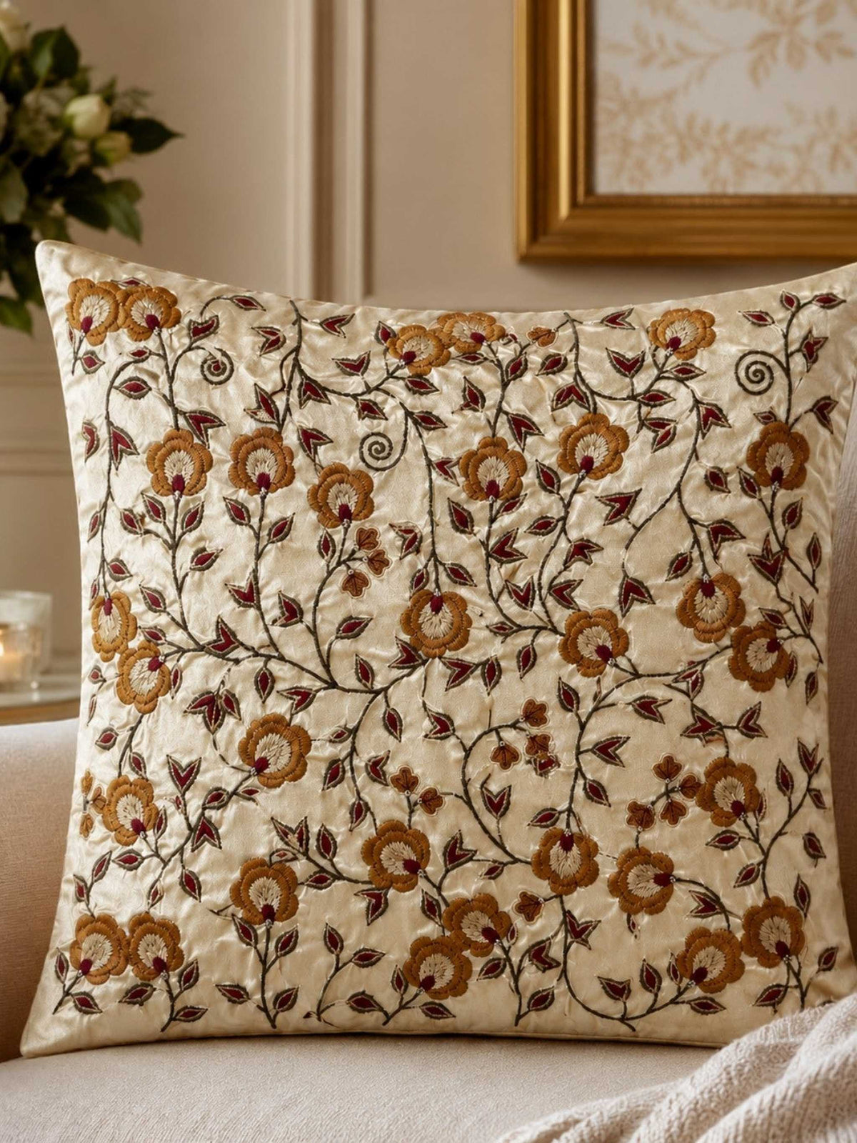 Jagdish Store 16x16 cream cushion cover with gold and burgundy floral embroidery and delicate beadwork accents.