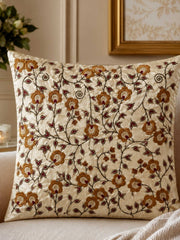 Jagdish Store 16x16 cream cushion cover with gold and burgundy floral embroidery and delicate beadwork accents.
