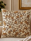 Jagdish Store 16x16 cream cushion cover with gold and burgundy floral embroidery and delicate beadwork accents.