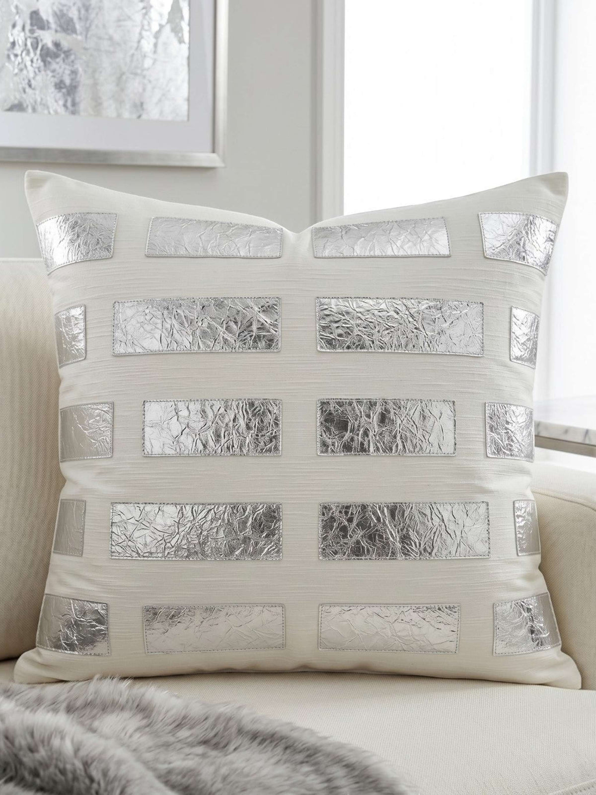 Jagdish Store cream throw pillow cover with staggered metallic silver leather rectangular accents for modern home decor.
