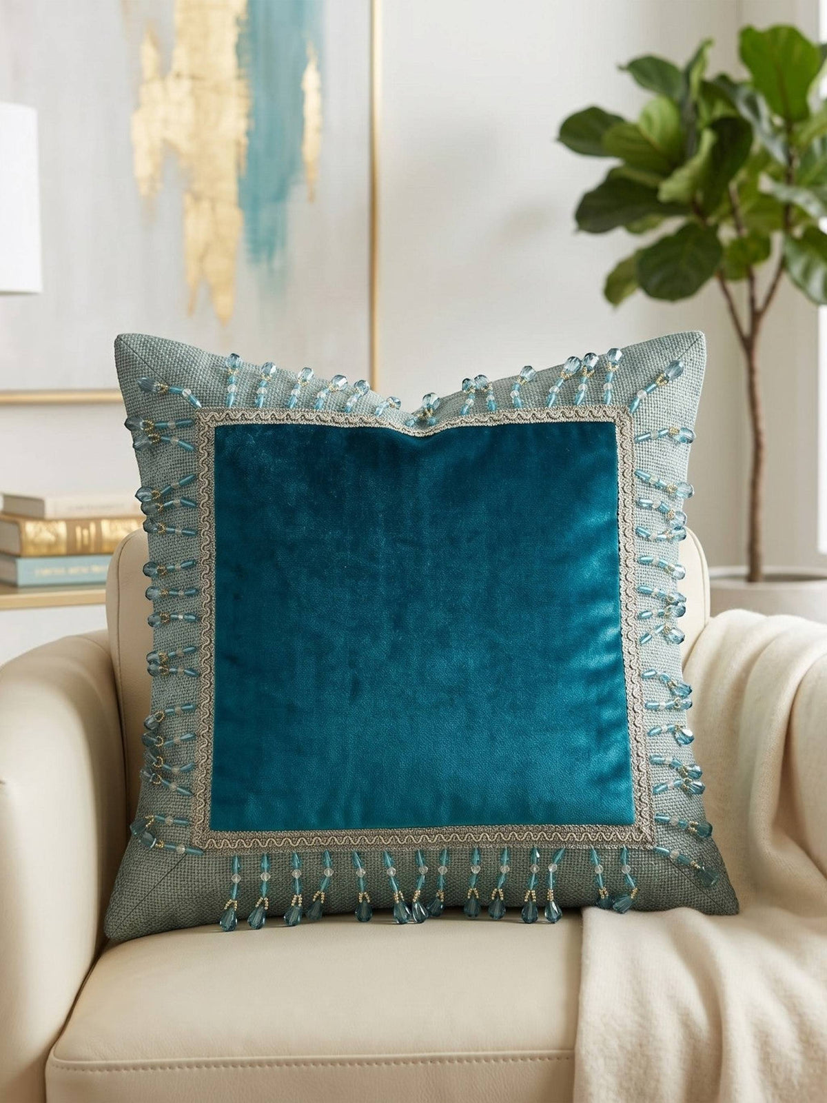 Jagdish Store teal velvet throw pillow cover with woven border and dangling crystal bead fringe trim.