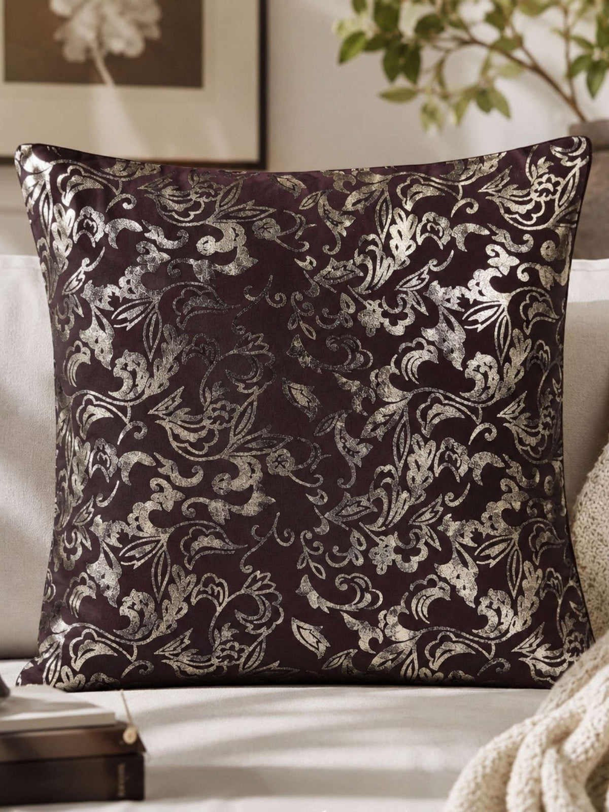 Dark aubergine velvet cushion cover with a silver foil floral print
