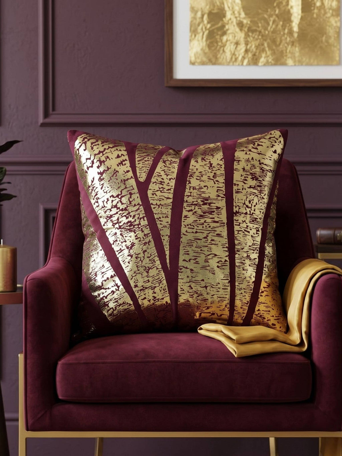 Jagdish Store burgundy cushion cover with abstract gold foil pattern for a luxurious modern home decor accent.