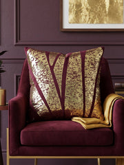 Jagdish Store burgundy cushion cover with abstract gold foil pattern for a luxurious modern home decor accent.