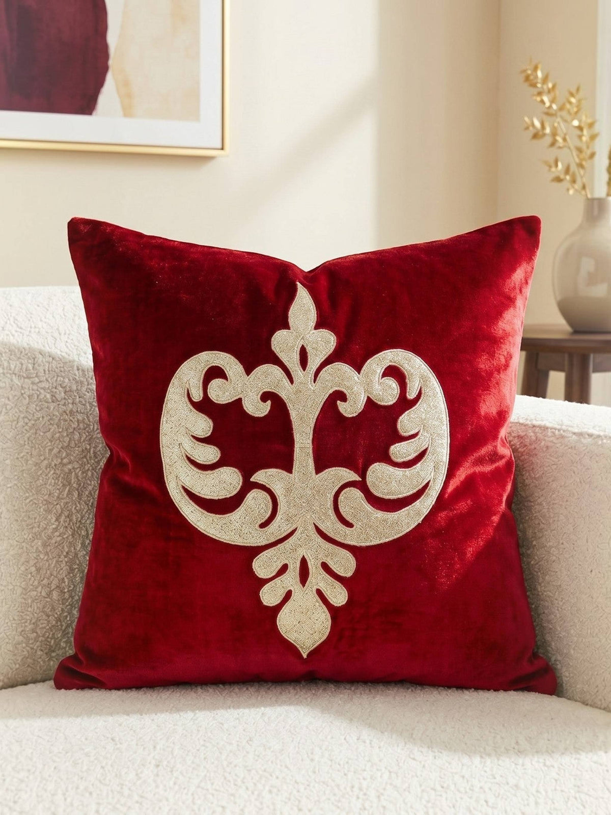 Jagdish Store red velvet cushion cover with an intricate gold glitter filigree motif for festive home decor.