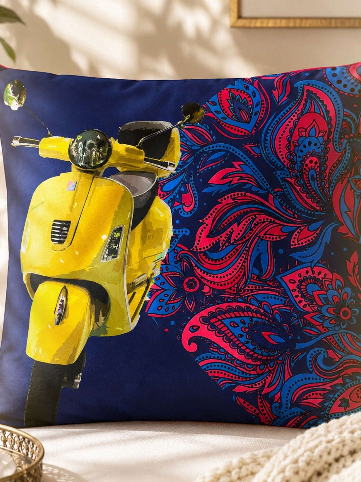 Jagdish Store reversible throw cushion cover with yellow scooter and pink and blue paisley print on navy fabric.