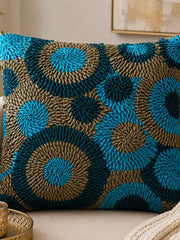 Jagdish Store decorative Cusion cover with teal, turquoise, and bronze fabric ribbons in concentric circles.