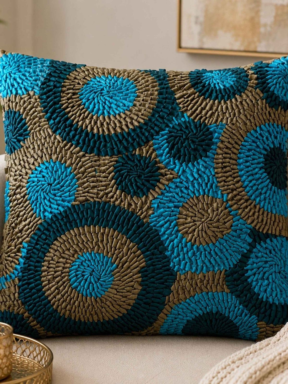 Jagdish Store decorative Cusion cover with teal, turquoise, and bronze fabric ribbons in concentric circles.