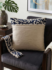 Beige cushion cover with detachable black patterned accent strip