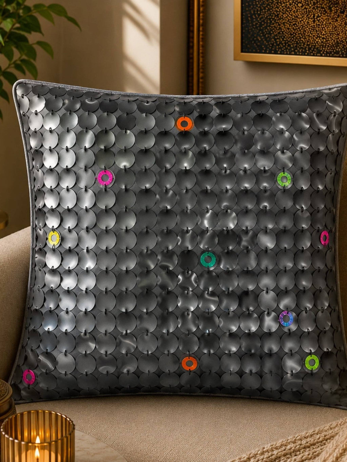 Jagdish Store grey textured cushion cover with overlapping circular discs and colorful rings in neon pink, teal, orange, and lime green.