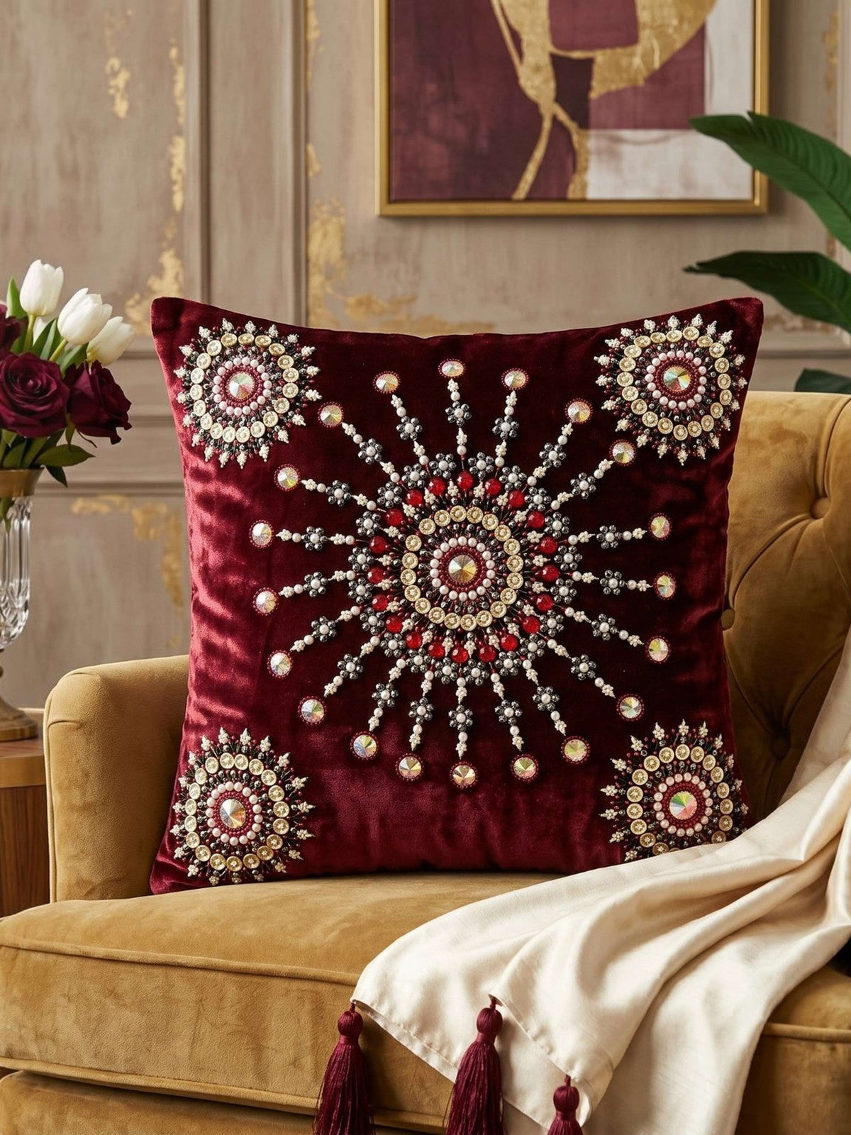 Jagdish Store maroon velvet cushion cover with intricate beaded mandala embroidery and decorative crystal accents.