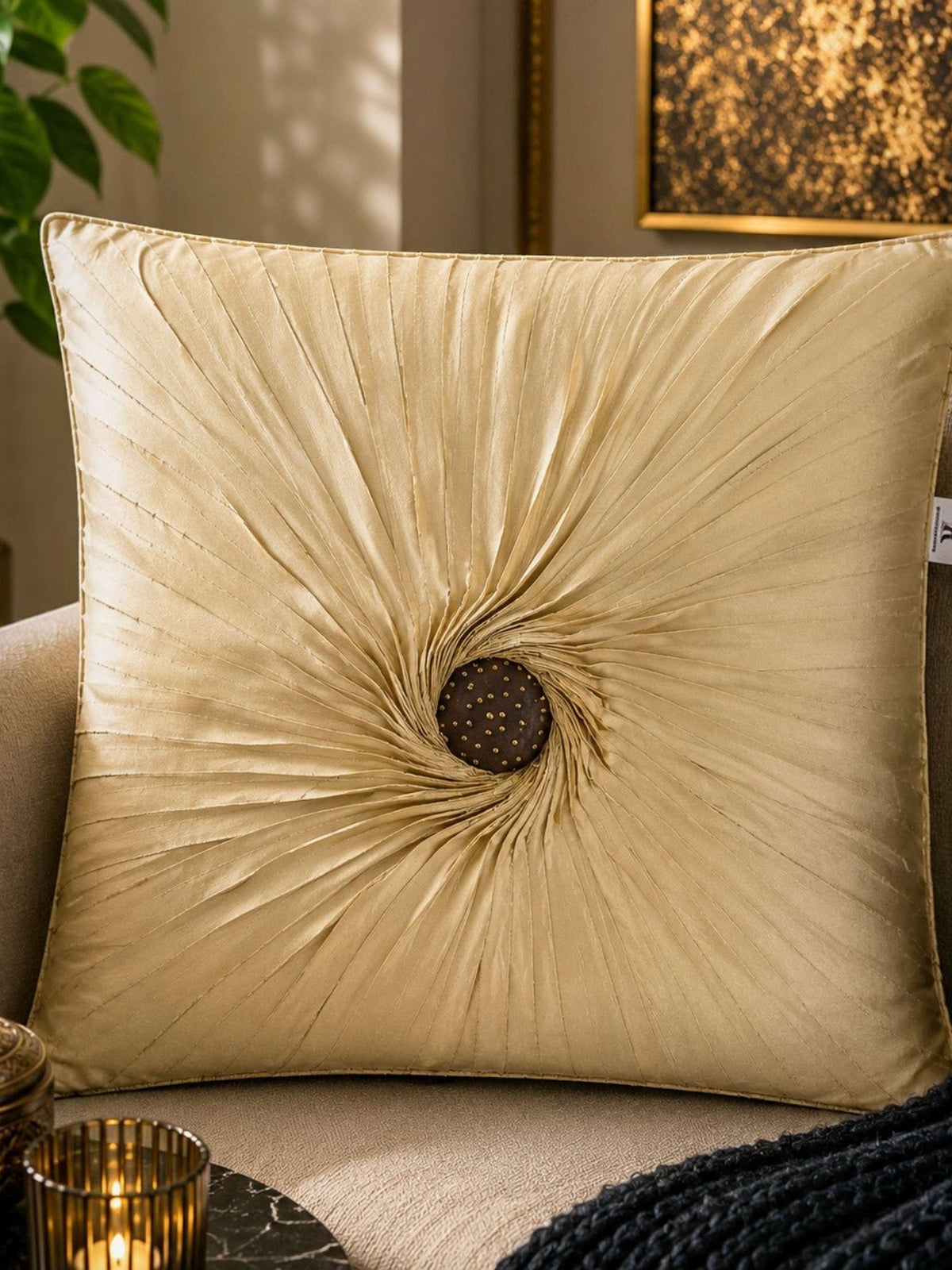 Jagdish Store beige embellished accent cushion cover with radiating pleats and gold accents.