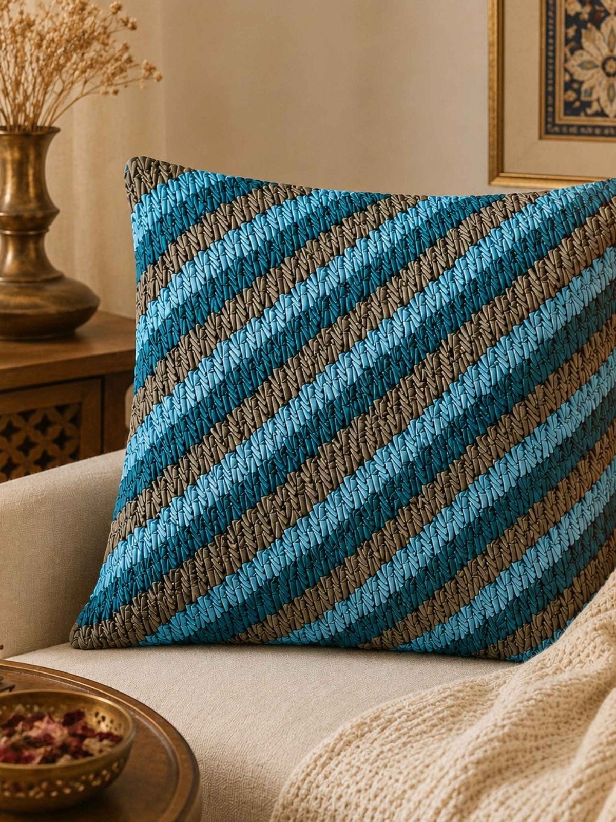 Jagdish Store decorative cushion cover with textured blue and gray stripes and smocked detail.