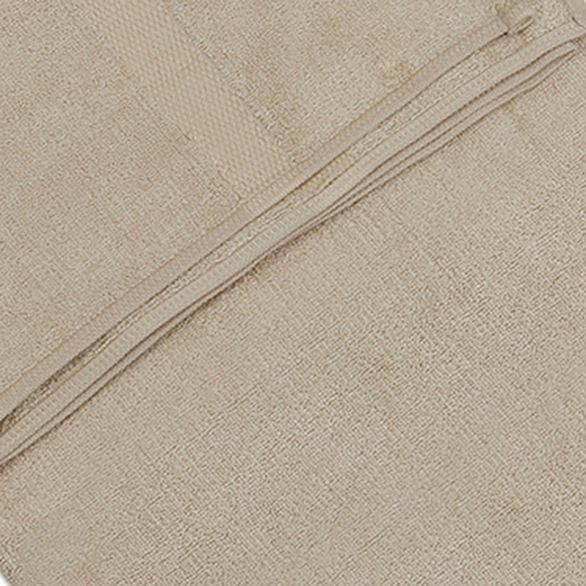 Close-up of fawn beige bamboo bath towel fabric texture with a folded edge