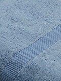 Light blue cotton bath towel folded texture view