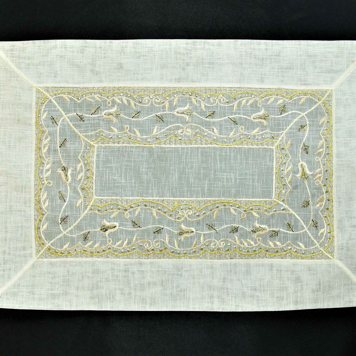 Cream tissue table mat embroidery stitch detail close-up
