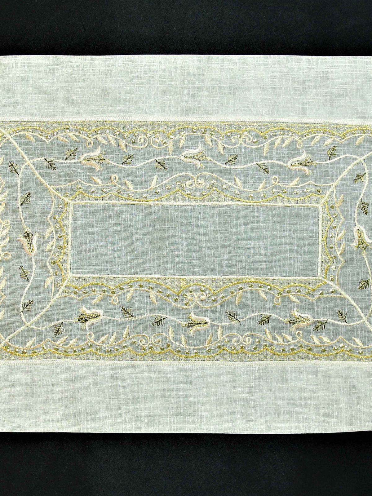 Cream tissue table mat embroidery stitch detail close-up