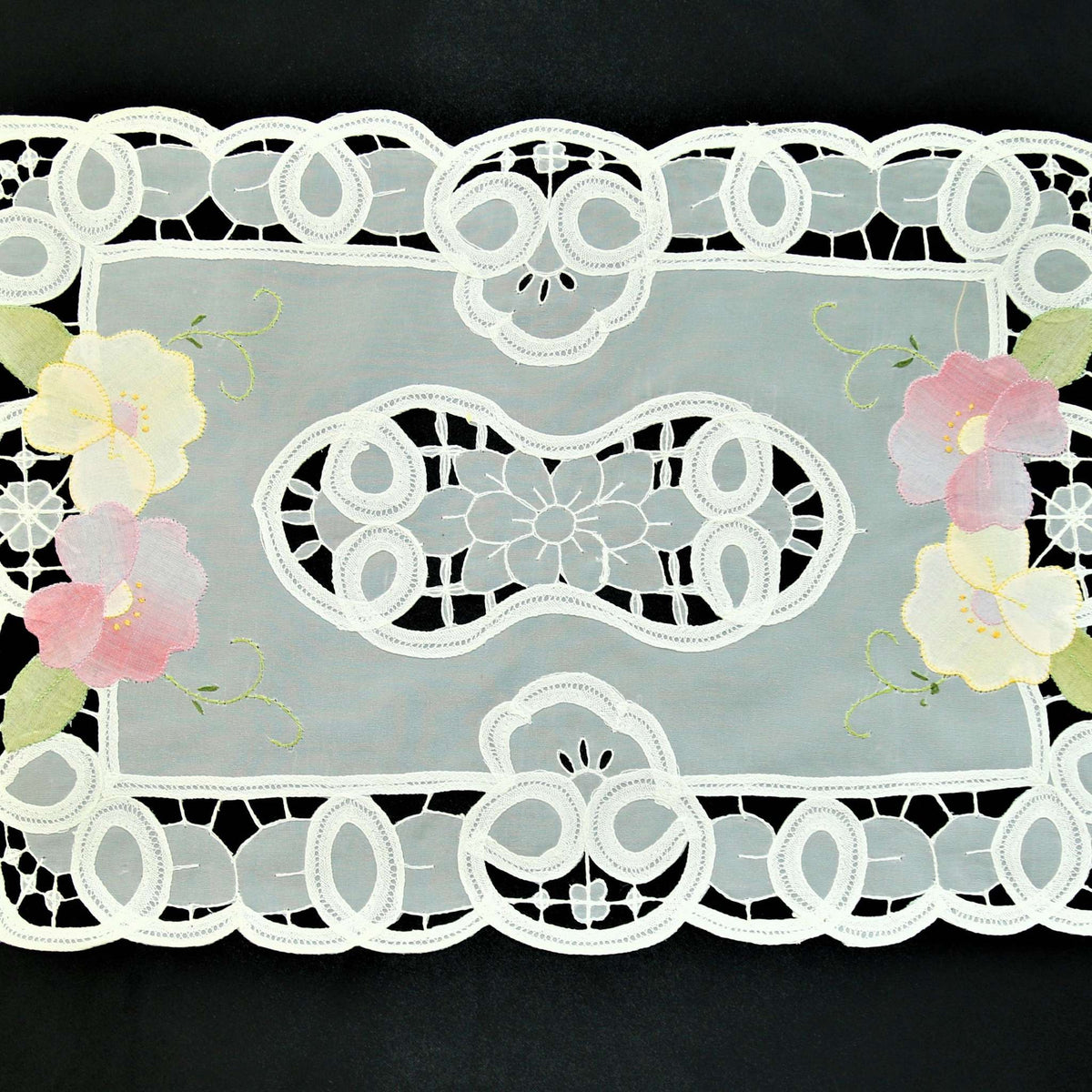 White organza table mat cutwork lace detail close-up