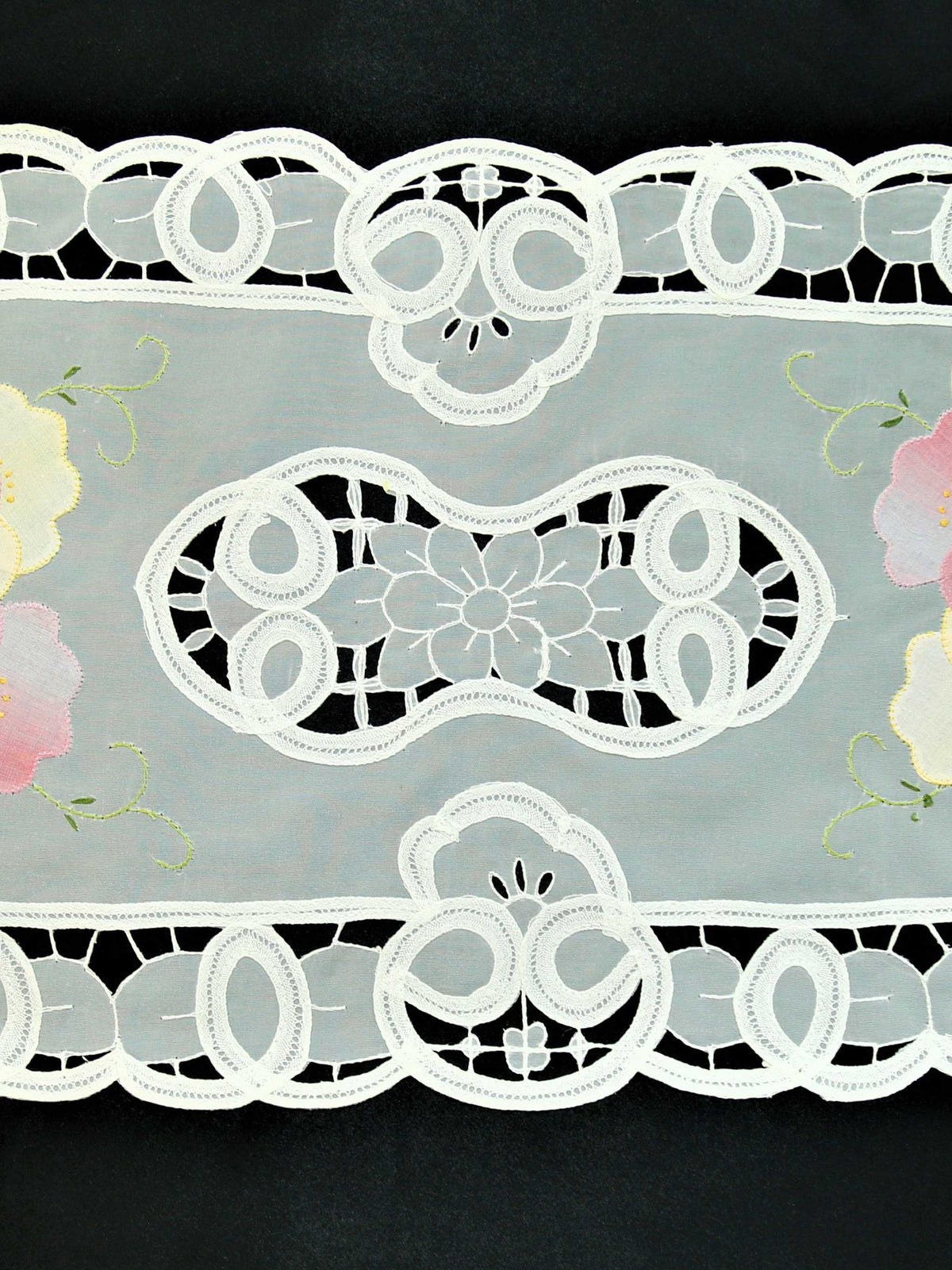 White organza table mat cutwork lace detail close-up