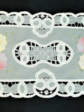 White organza table mat cutwork lace detail close-up
