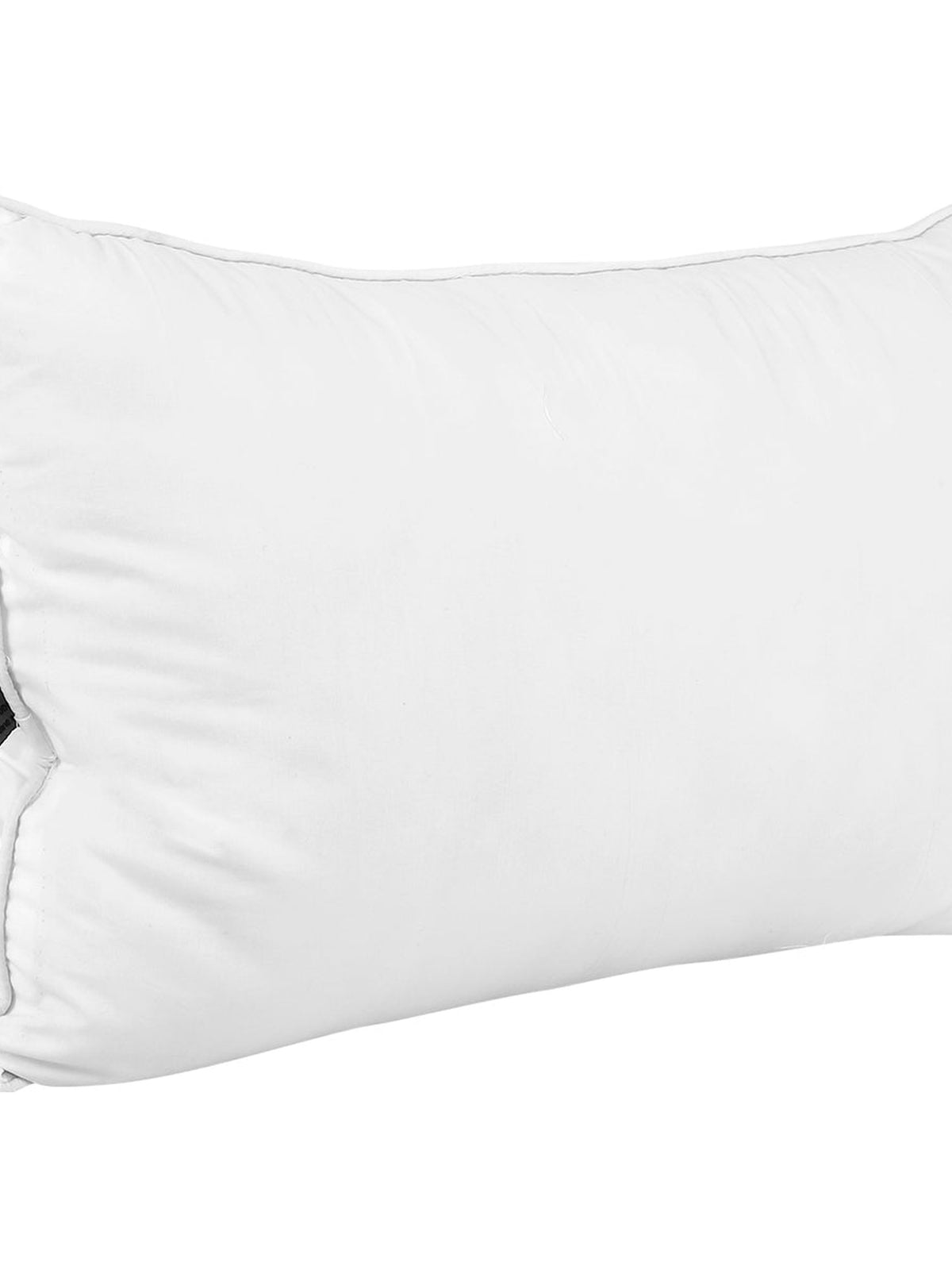 White piped polyfill pillow insert upright, with a black brand tag on the seam