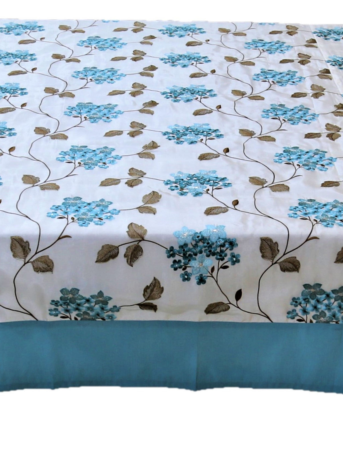 White table cover with a blue embroidered hydrangea floral pattern, brown leaves, and a teal-blue border