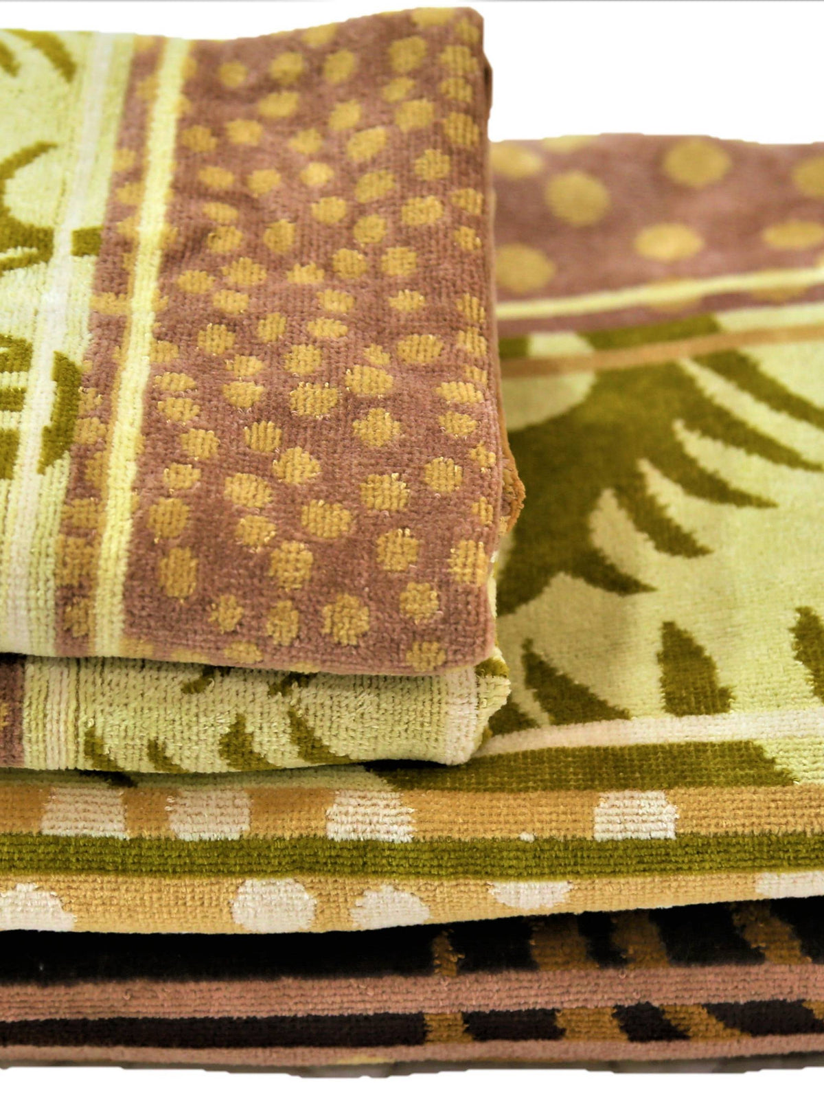 Golden-olive cotton towel set with a woven paisley-feather motif