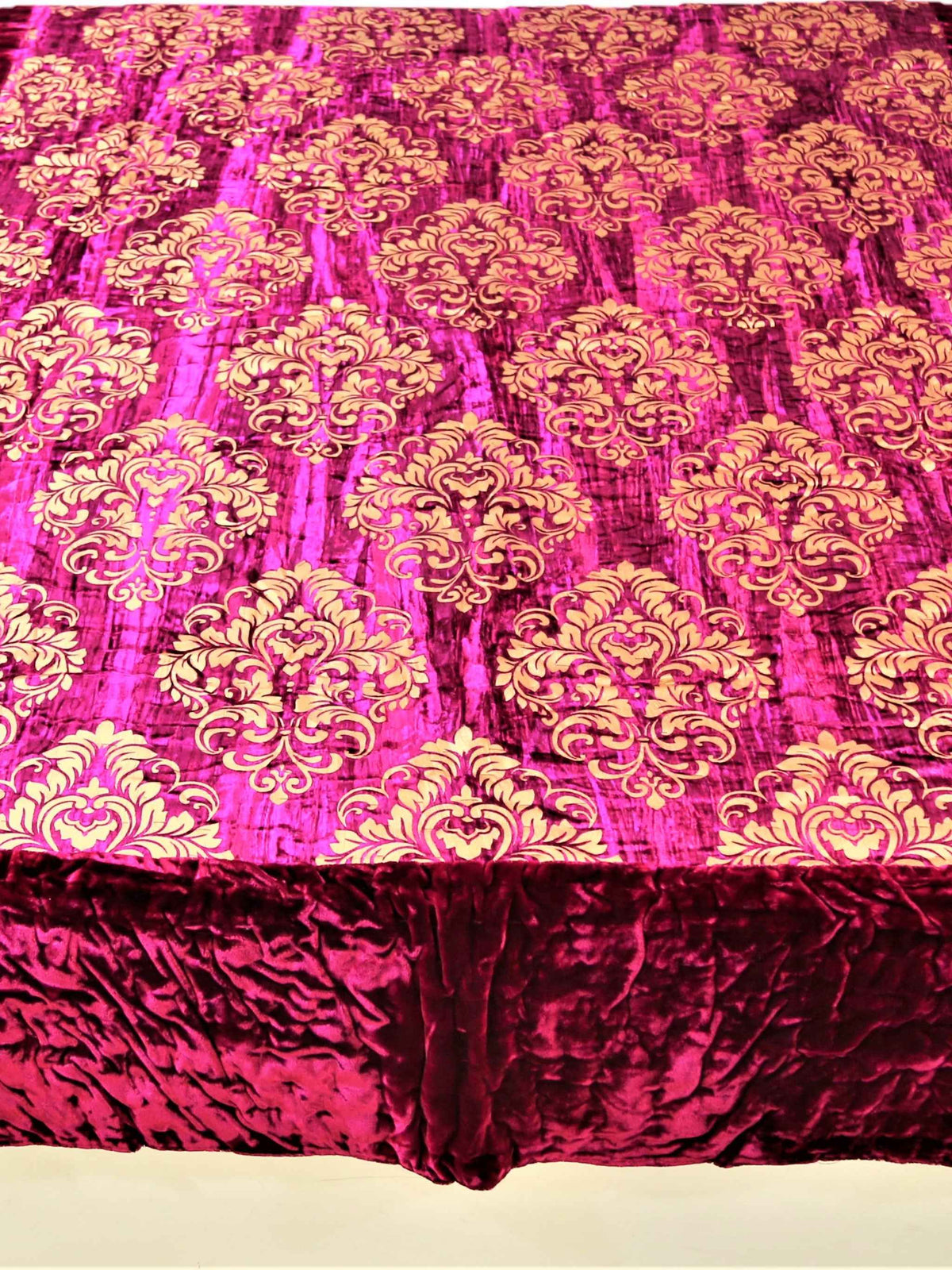 Magenta chenille quilt with gold foil damask print and maroon-purple border