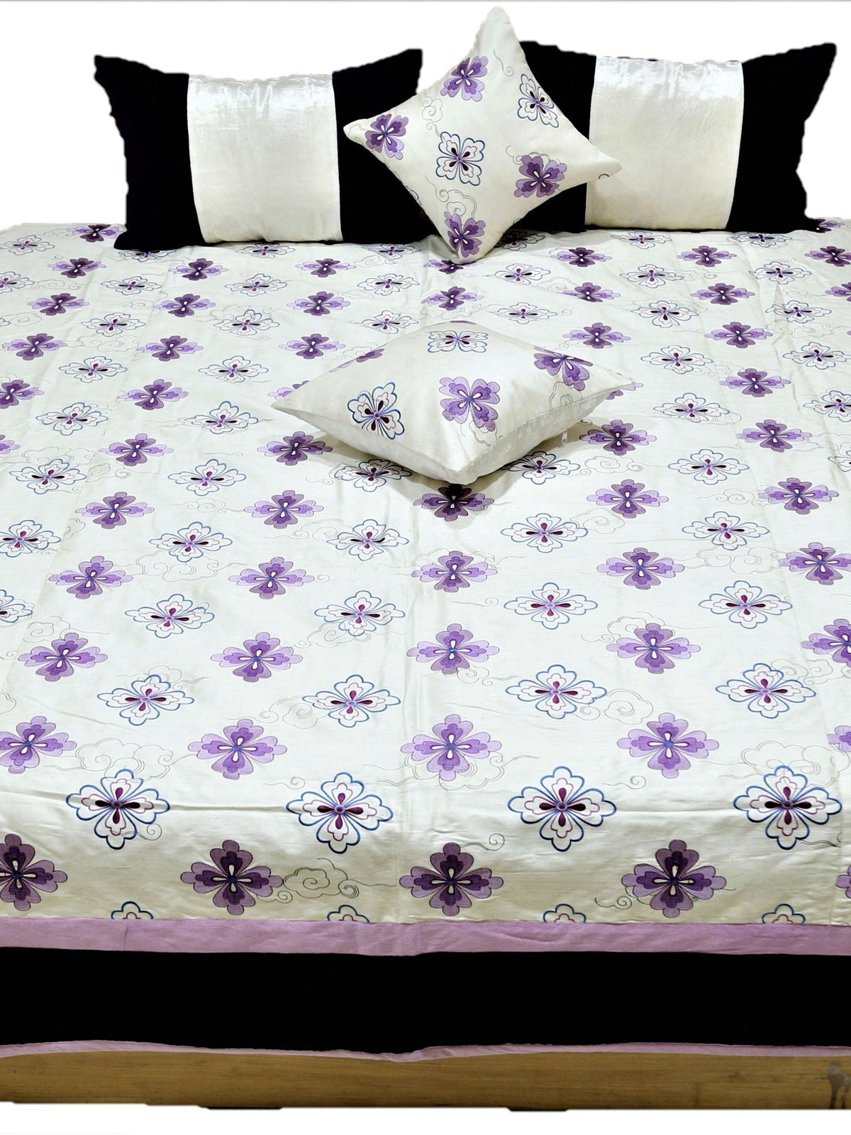 Front view of the white and purple flower quilted bedcover set with matching cushions