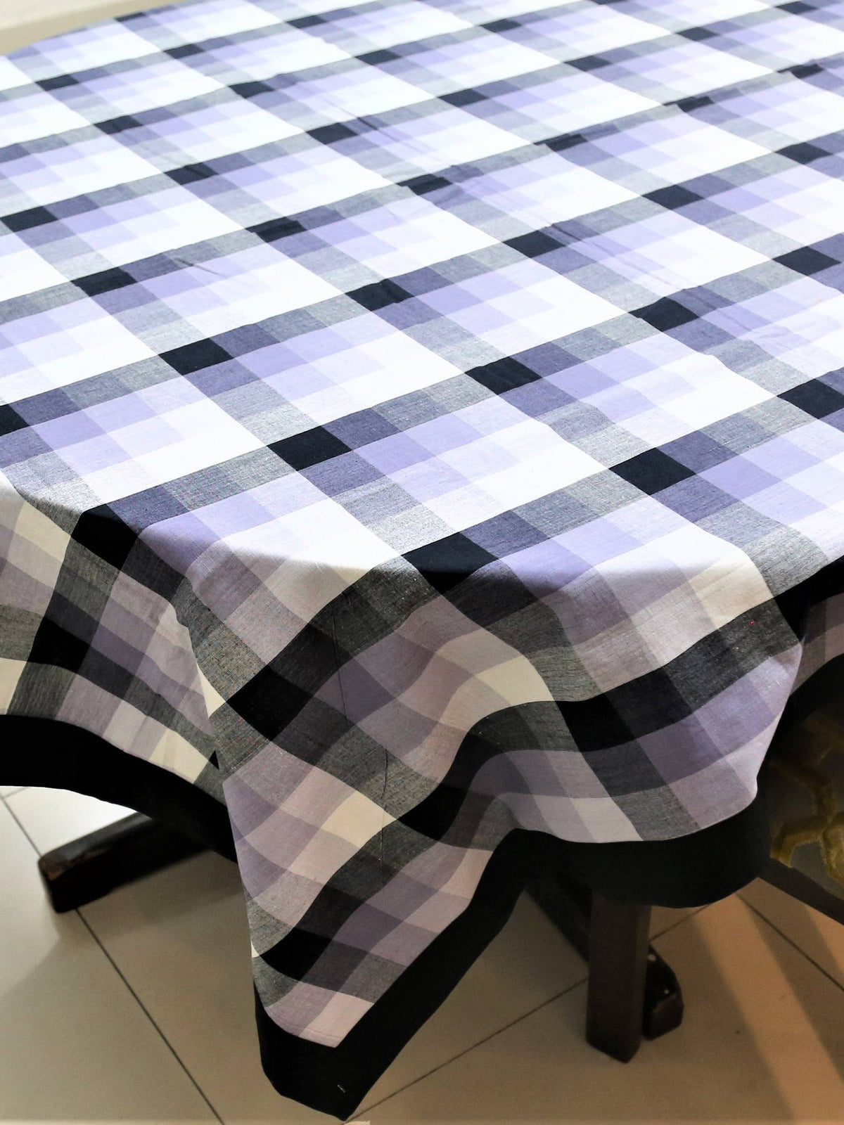 White, lavender, and black buffalo-check plaid oval table cover