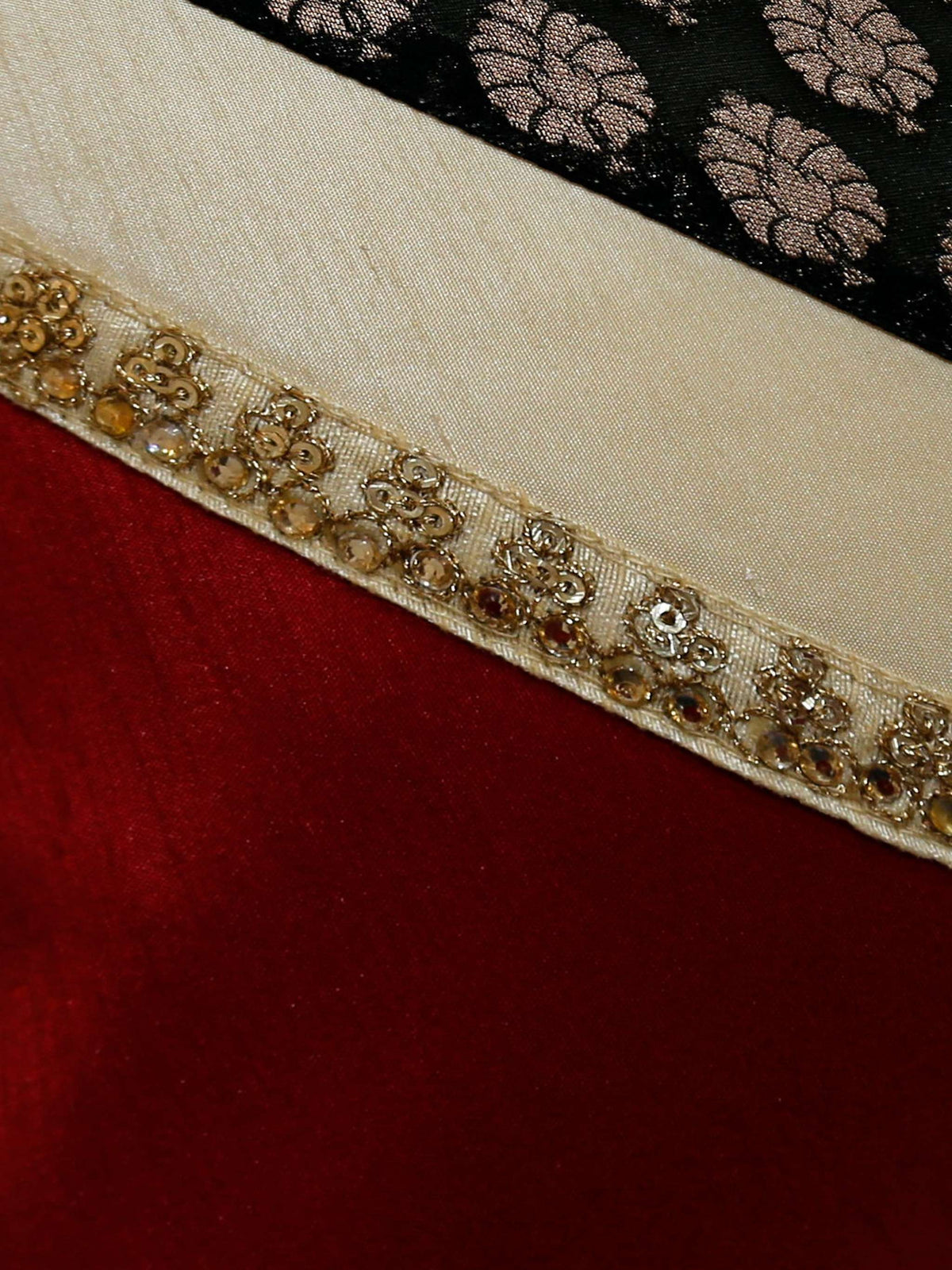 Close up of the diagonal join showing red silk, cream band and gold beaded trim