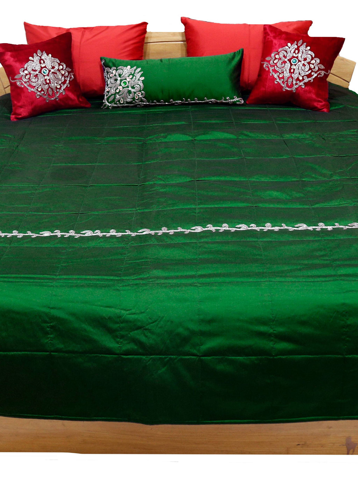 Green pearl work bedcover flat view with red and green silver embroidered cushion covers