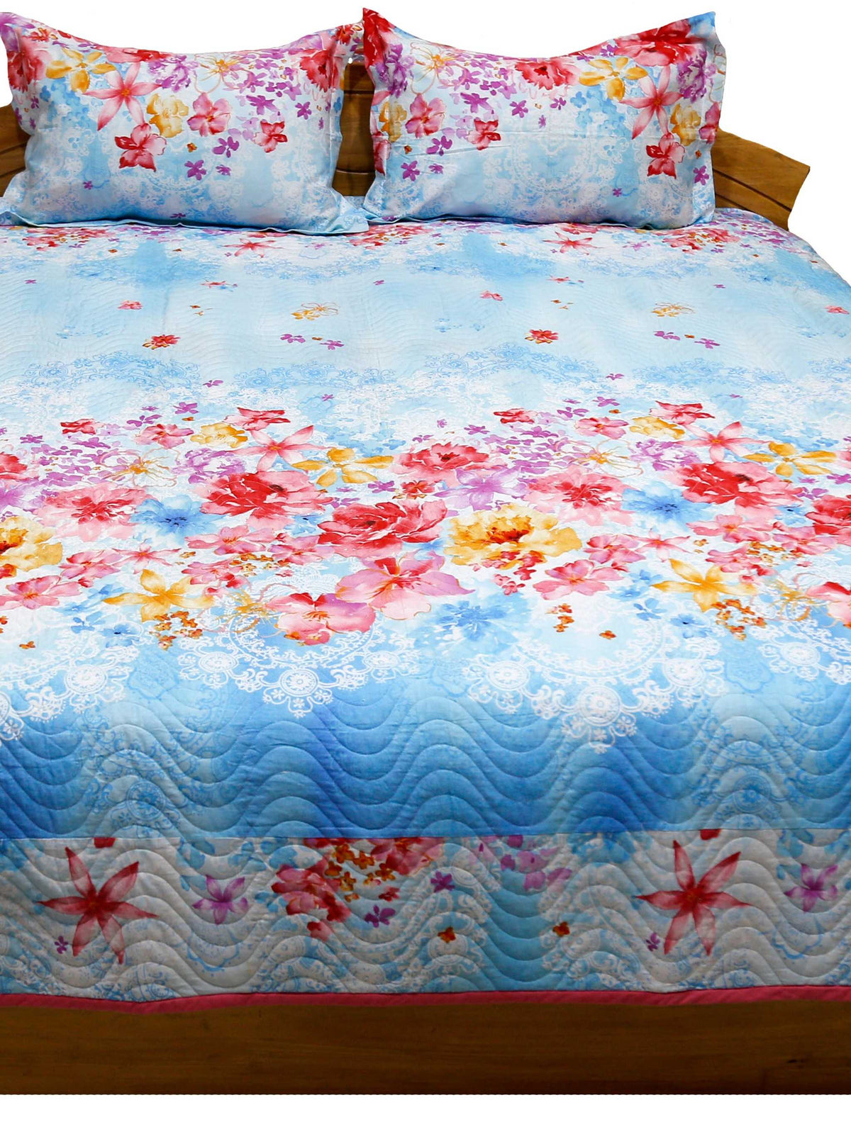 Sky blue floral printed quilted bedcover with matching pillow covers, straight view