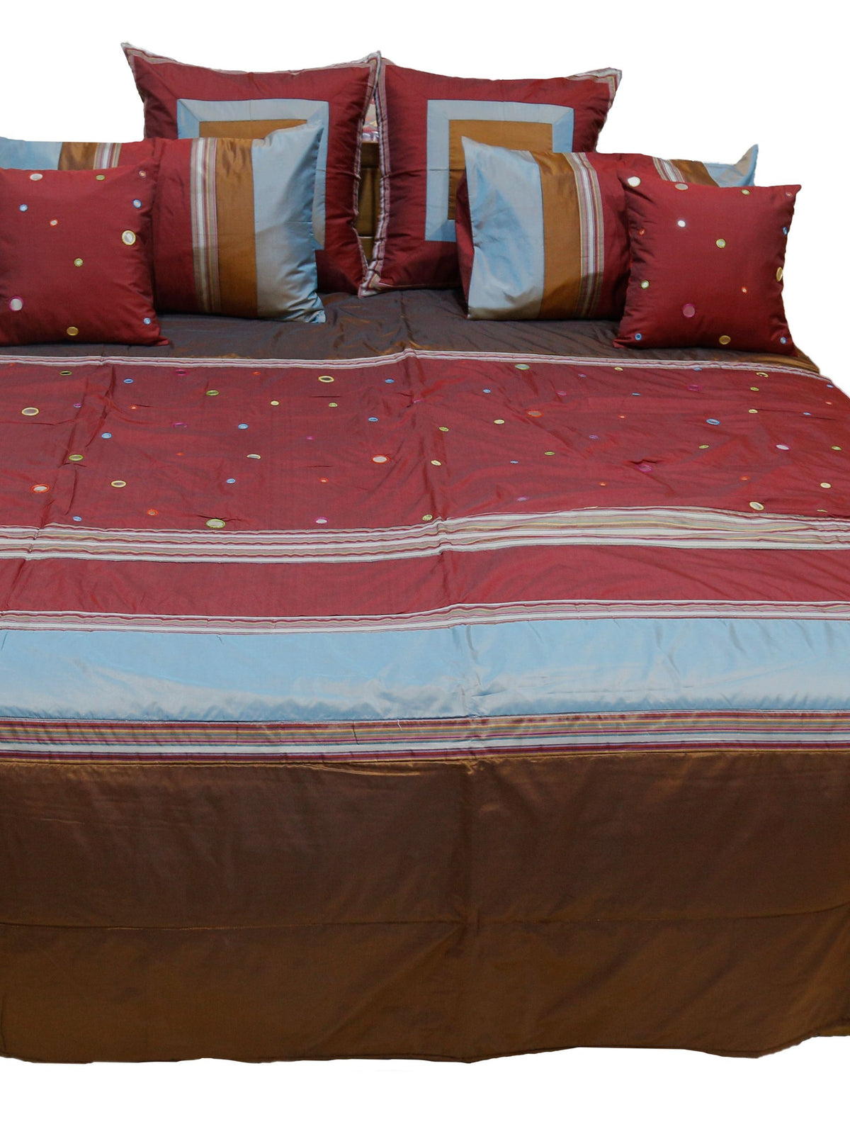 Maroon and brown bedcover with sky blue band and mirror work dots, straight view