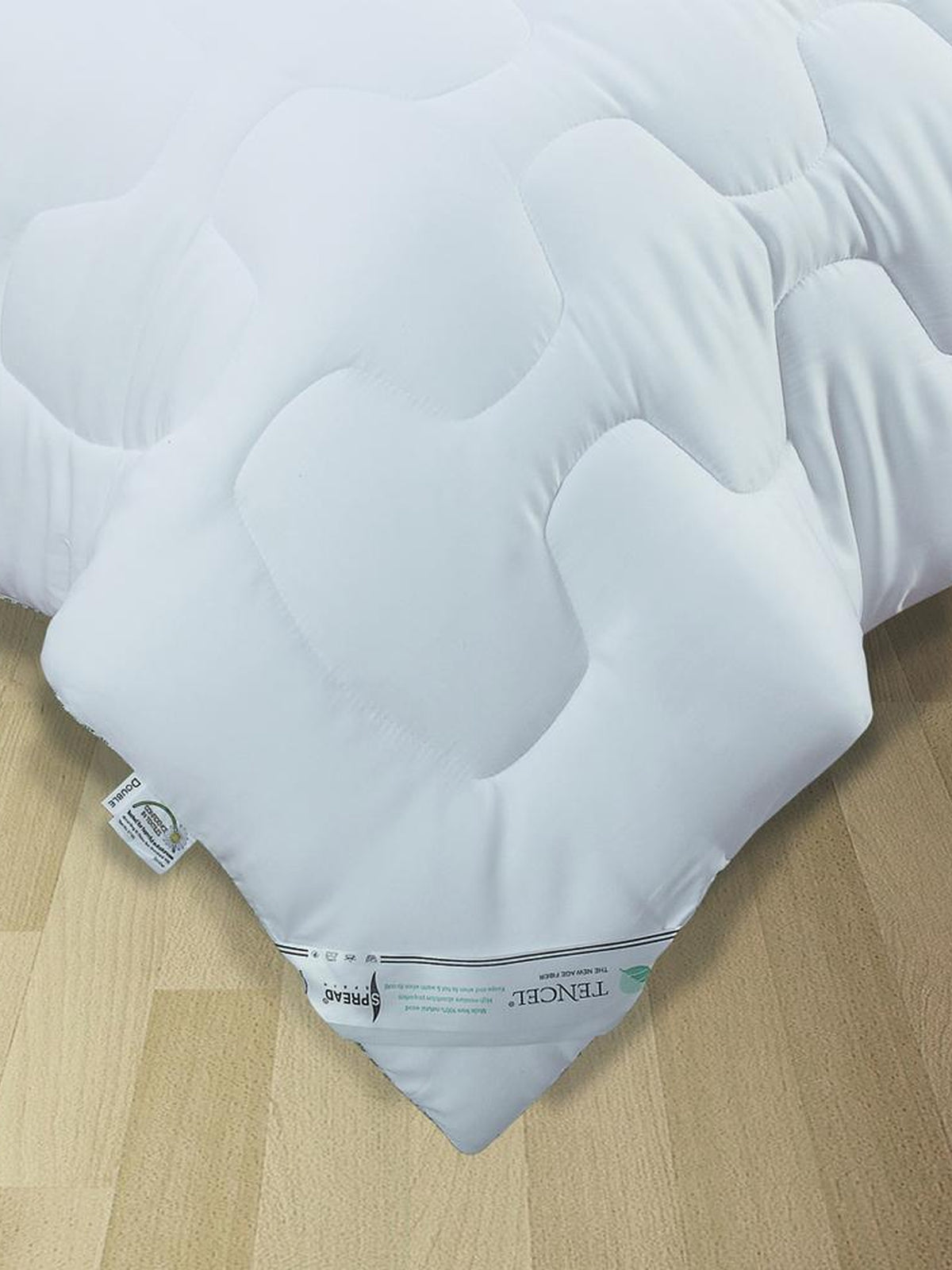 White tencel single bed quilt with honeycomb quilting texture