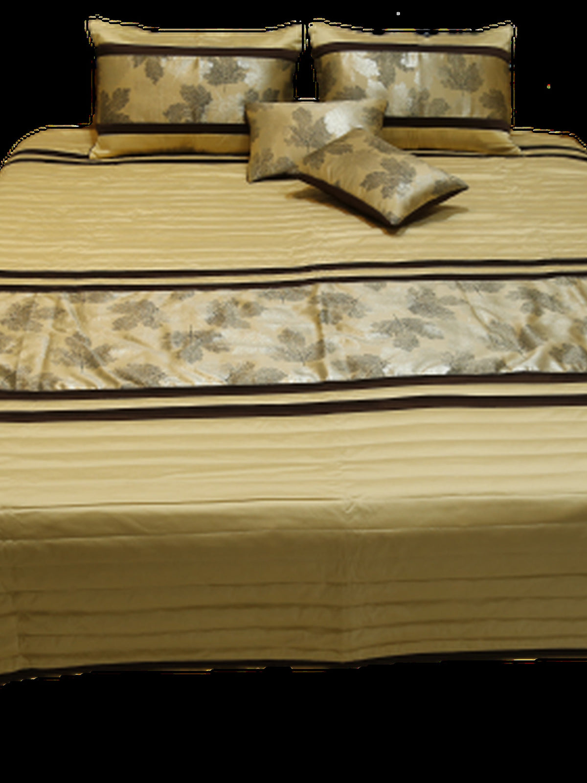 Gold striped bedcover made up with leaf-print shams and cushions, Silk Ambi
