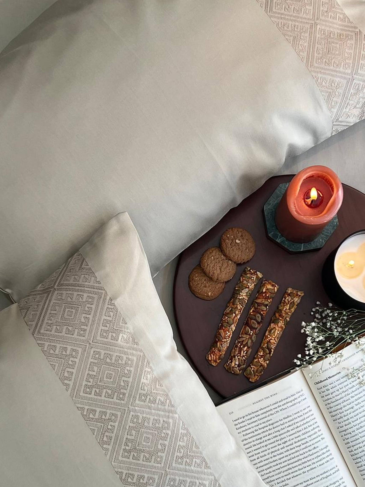 Ivory embroidered-panel pillows with a coffee tray, Beige Arcane Collection