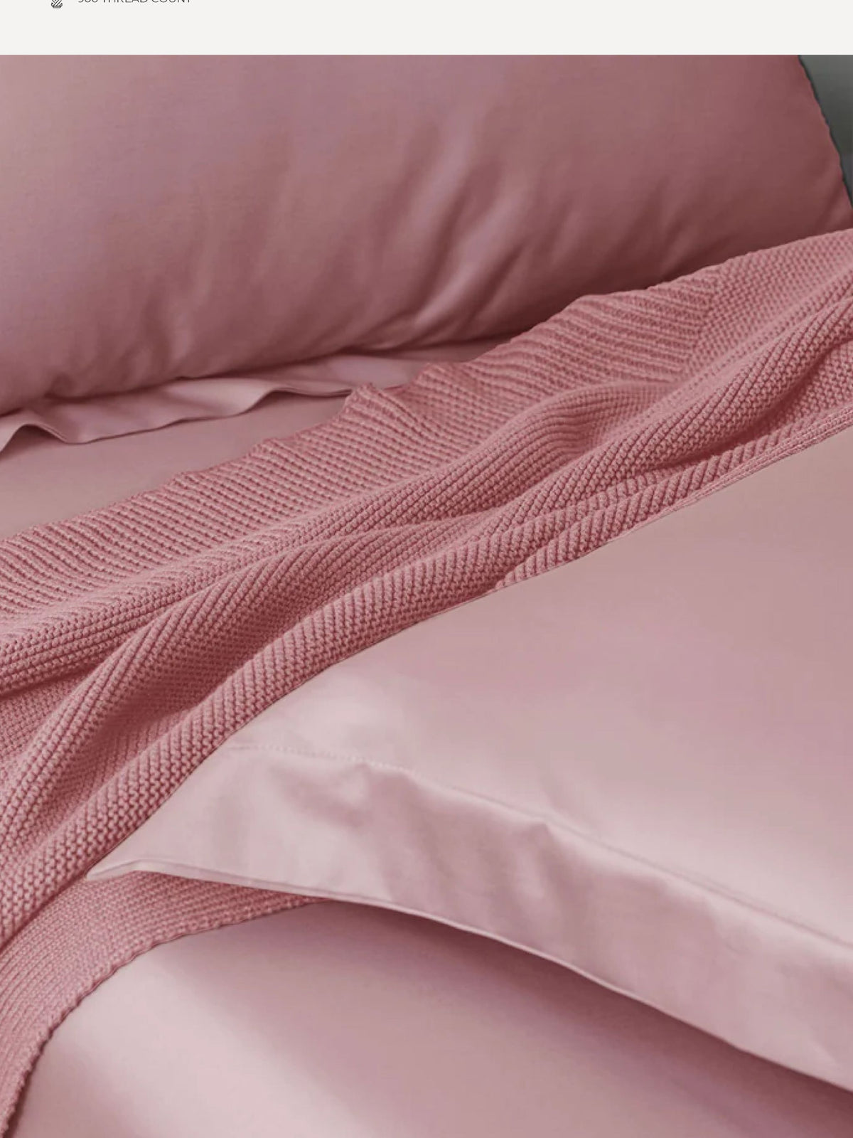 Dusty rose Supima cotton bedding with a matching waffle throw